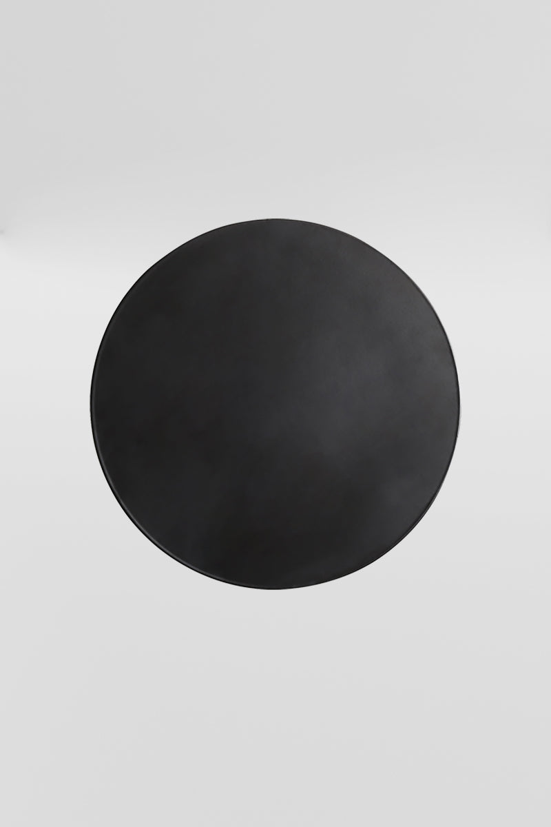 Small black circular back-lit LED wall light. 