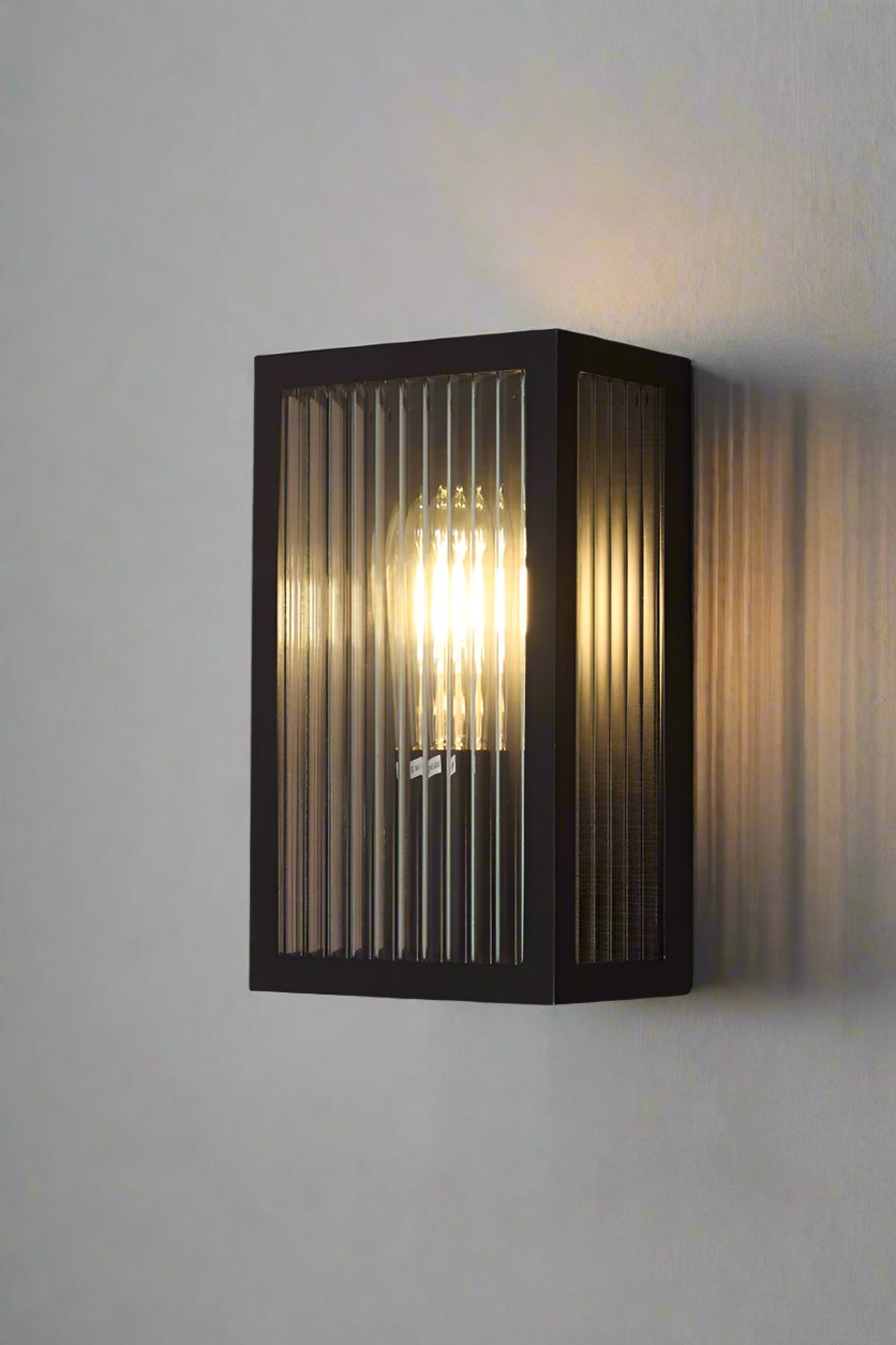 Front and side view of reeded glass wall light