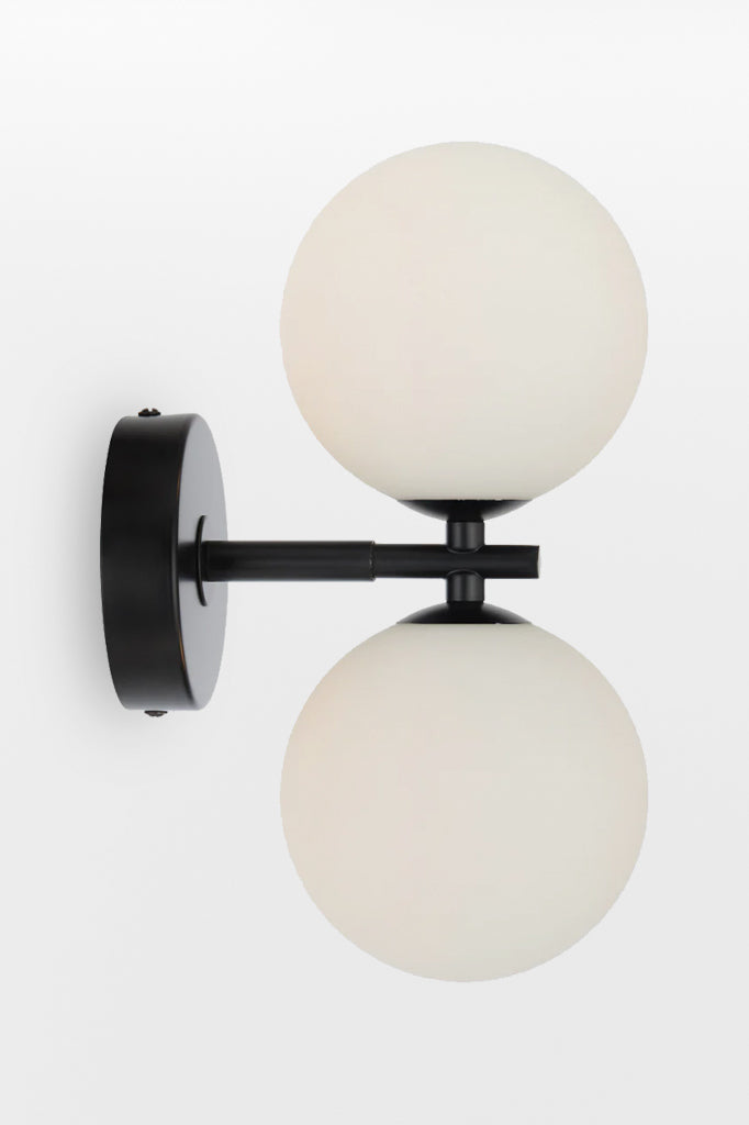 Black double up/down lampholder wall light with opal finish. 