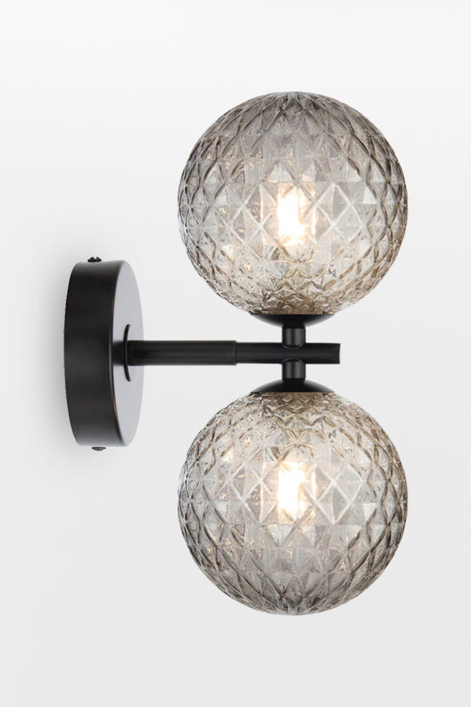 Black double up/down lampholder wall light with smoke tear finish. 