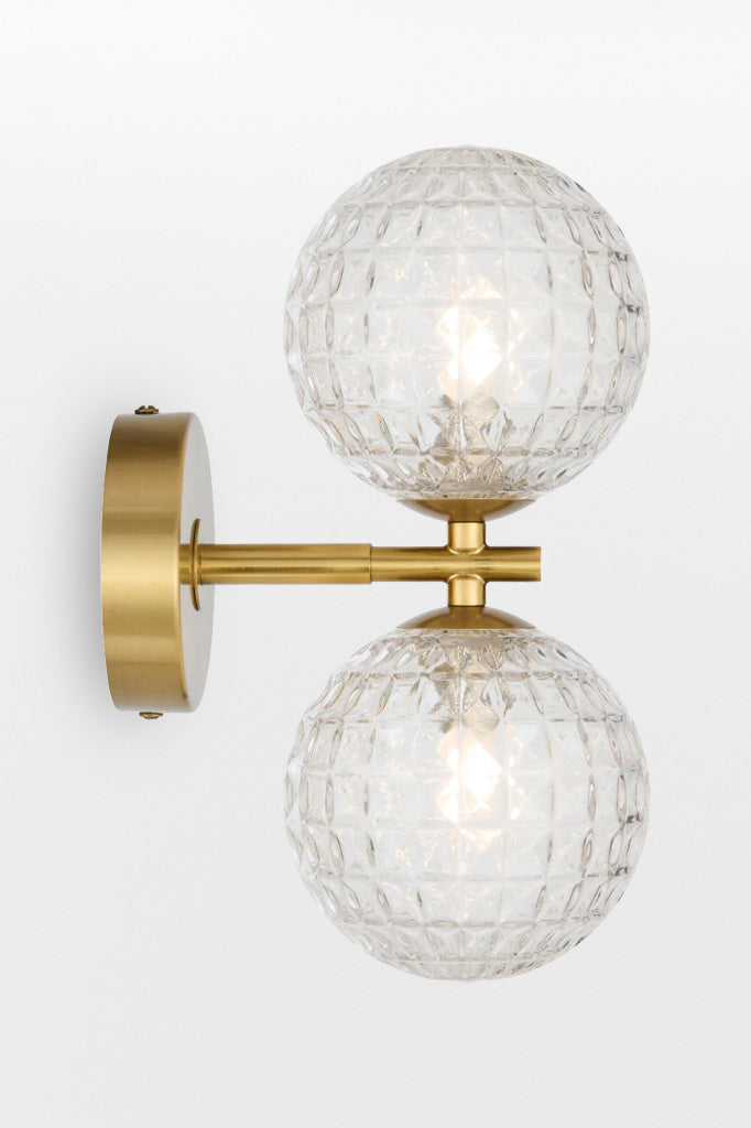 Gold double up/down lampholder wall light with clear prism finish. 