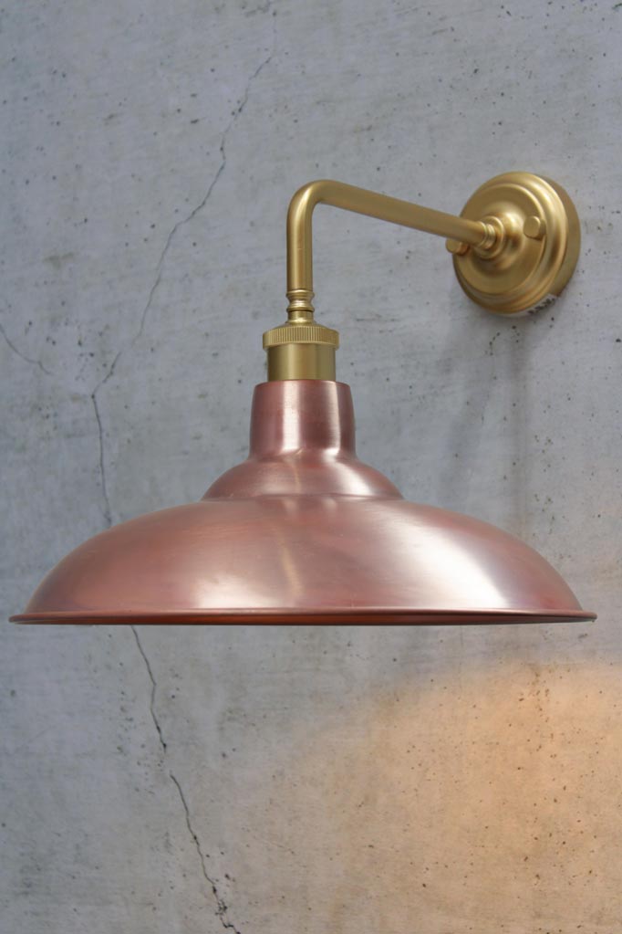 Gold/Brass 90 degree wall sconce with a solid copper shade.