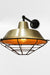 Bright brass wall light with cage guard