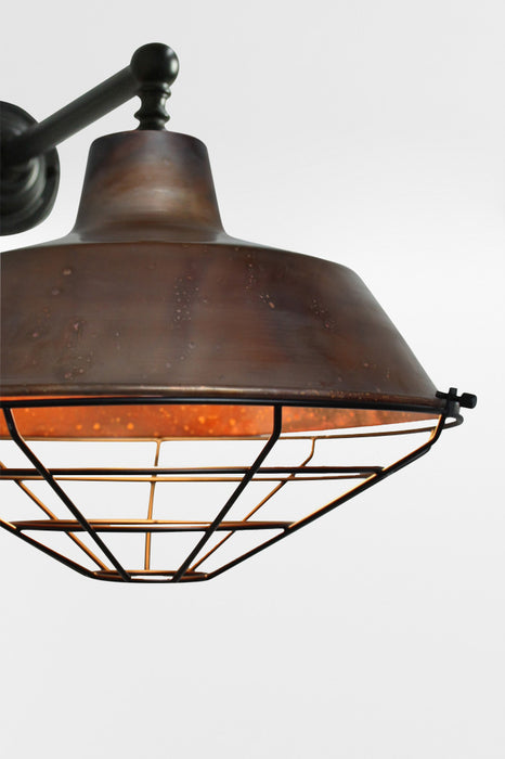 Pure copper wall light with black cage guard