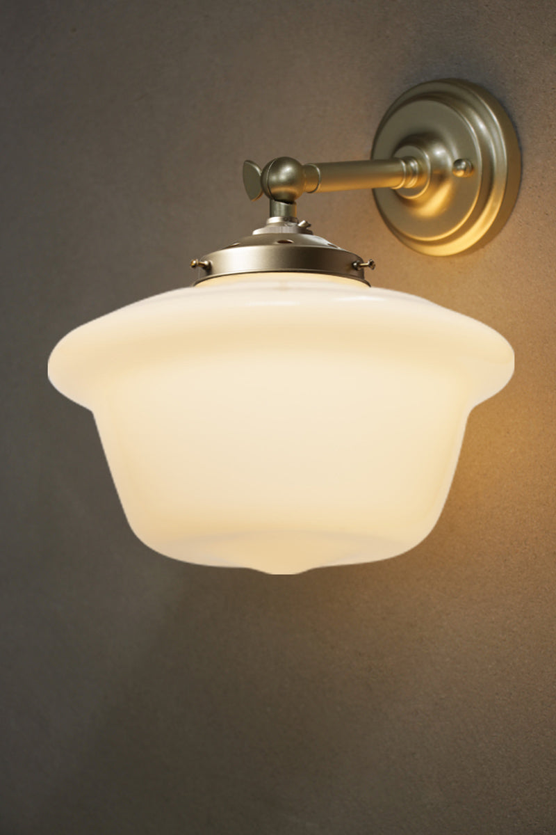 Medium Chelsea schoolhouse shades on a gold/brass straight arm wall sconce. 