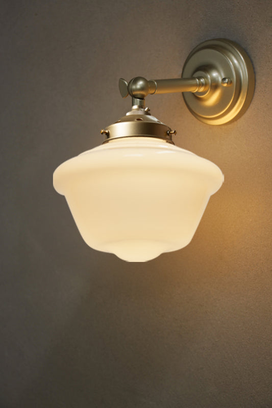 Small Chelsea schoolhouse shades on a gold/brass straight arm wall sconce. 