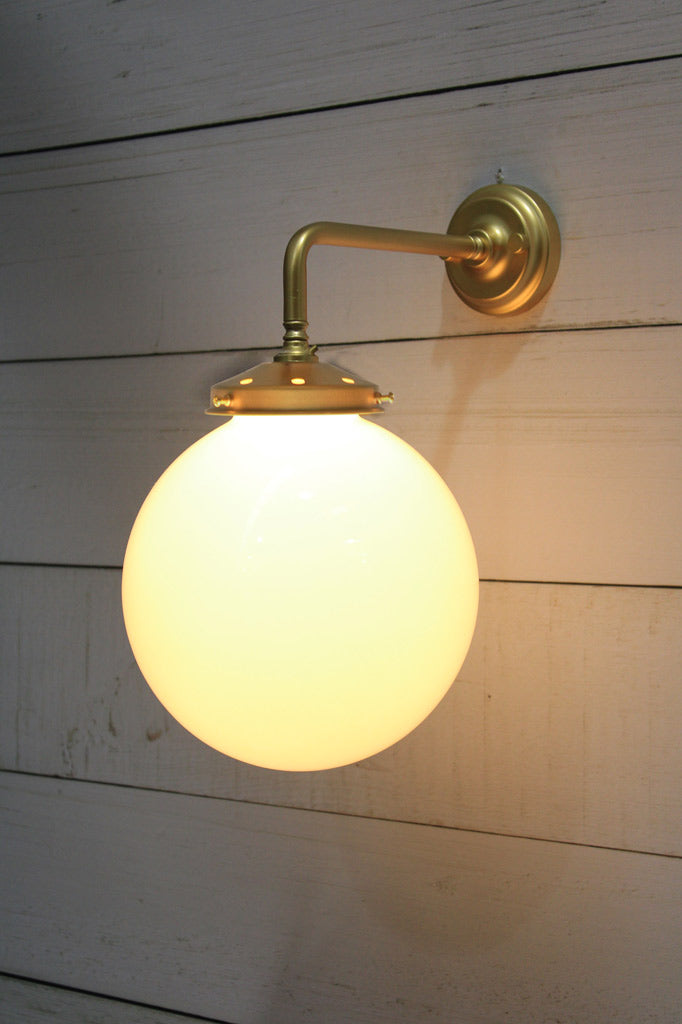 Medium Opal glass ball shade on a Gold/Brass 90 degree wall sconce