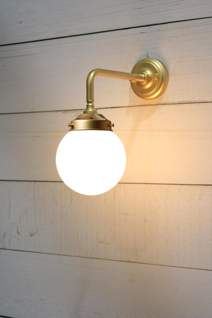 Small Opal glass ball shade on a Gold/Brass 90 degree wall sconce