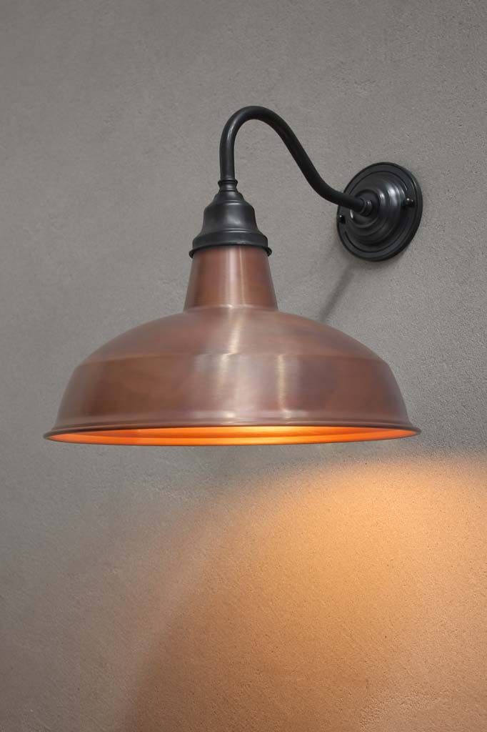 Warehouse Gooseneck Exterior Light with an antique bronze gooseneck arm and copper shade. 