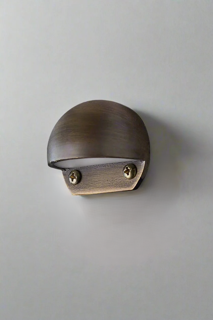 Aged Brass with brushed finish, eye lid light