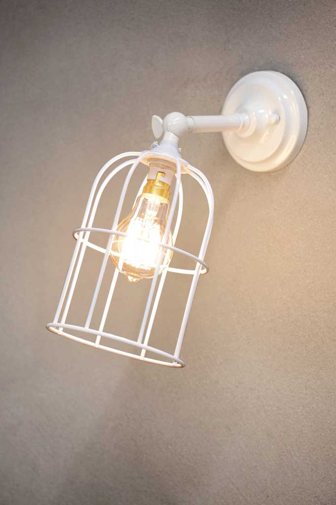 Cage Wall Light with short white sconce and white caged shade.