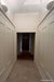 Two domed plaster wall lights on either side of a traditional hallway. 