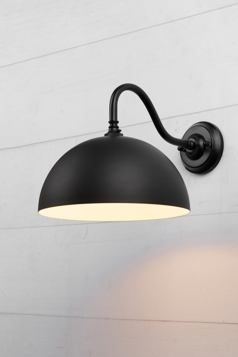 Black small dome shade on a black steel gooseneck sconce