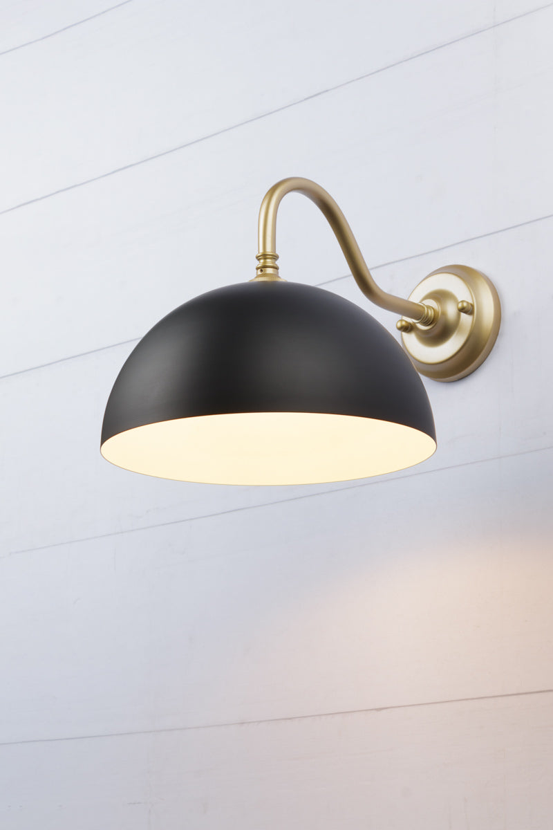 Small black dome shade on a steel gold/brass goosneck wall sconce