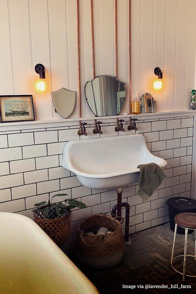  Two Bare Bulb wall sconce in black in a bathroom