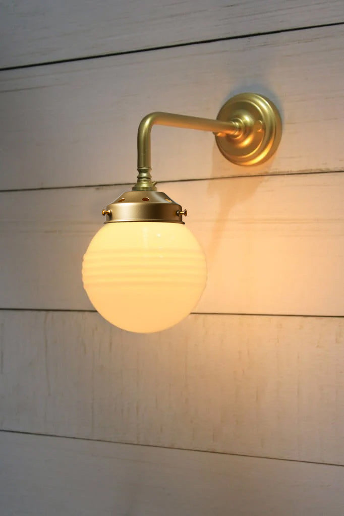 Opal Ridged glass ball shade on a Gold/Brass 90 degree wall sconce