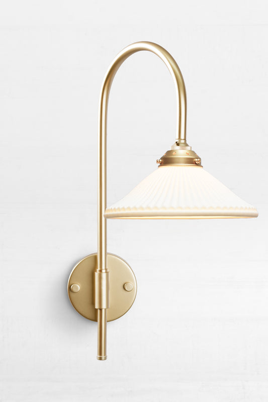 Shepard gooseneck wall light in gold/brass with a matt white ceramic shade. 