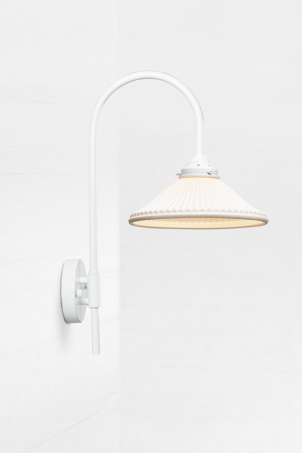 Shepard gooseneck wall light in white with a matt white ceramic shade. 