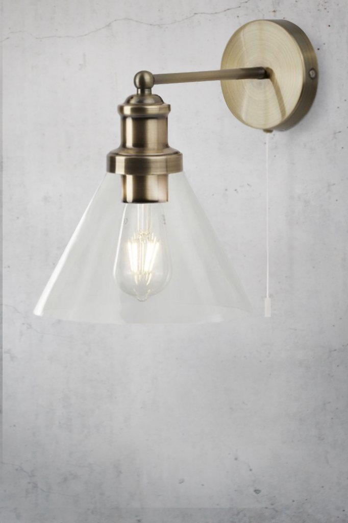 wall light in antique-brass finish