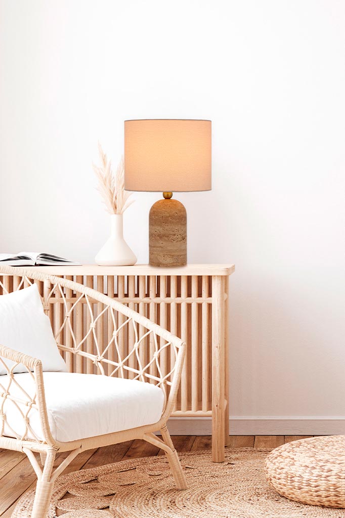 beige table lamp over wooden table.