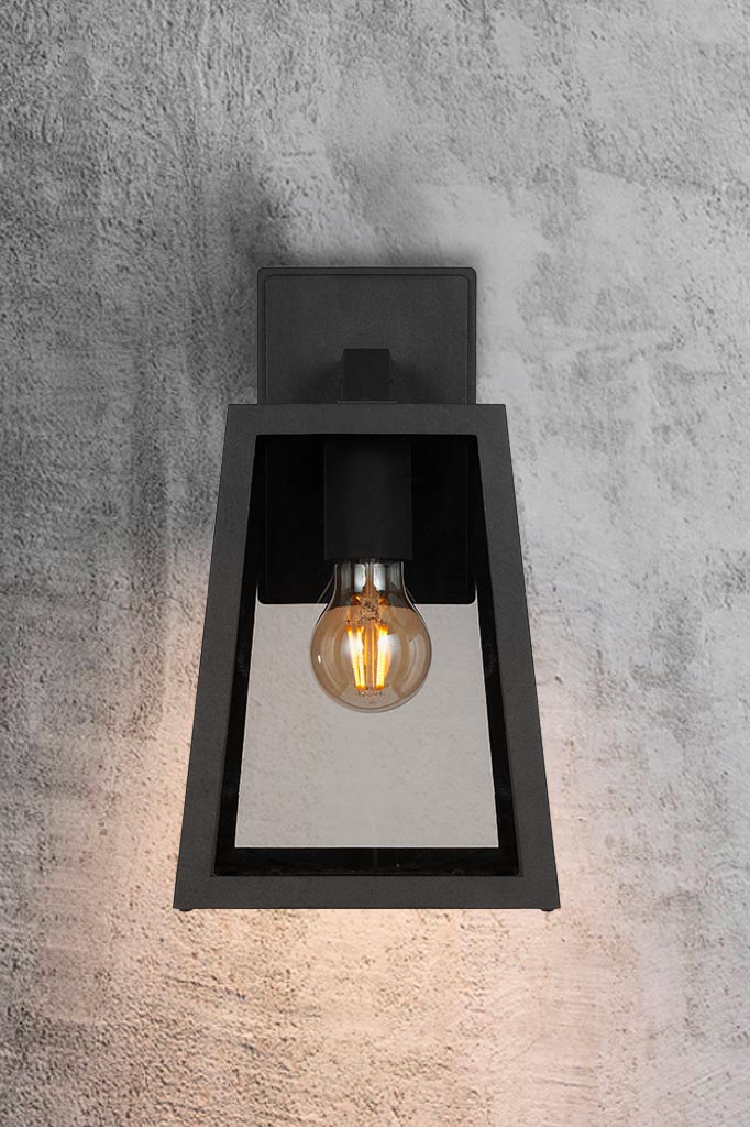 Front view of  the black large outdoor light brightening exterior areas