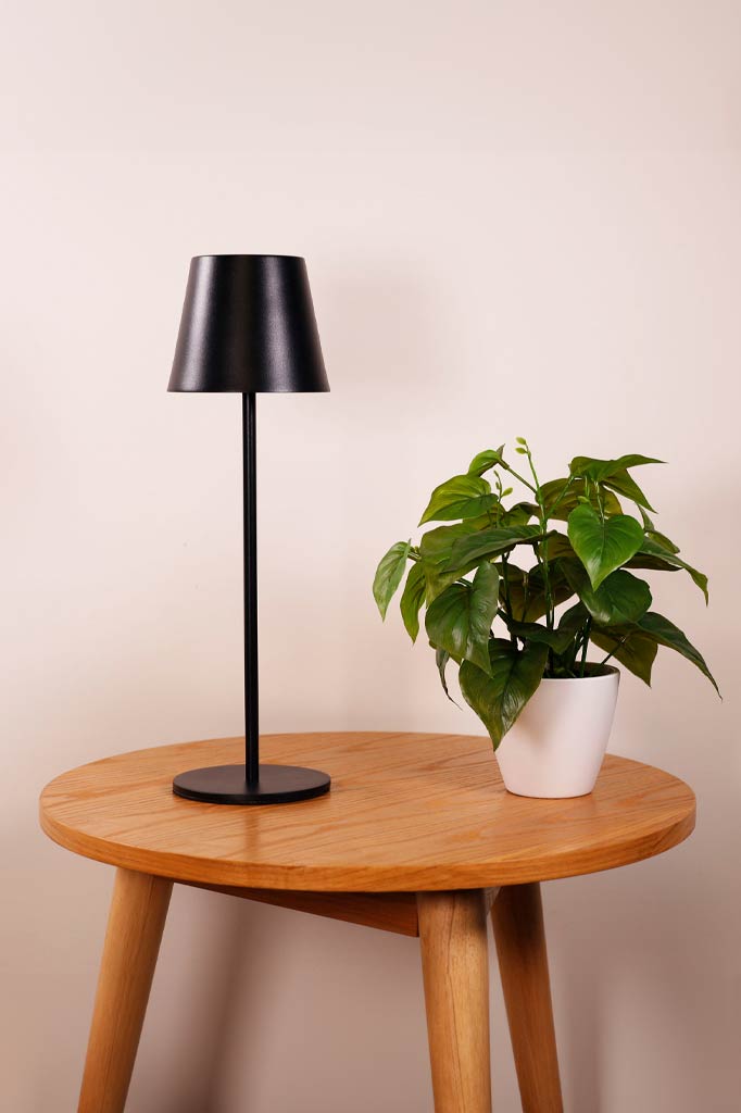 Black LED table lamp over a coffee table