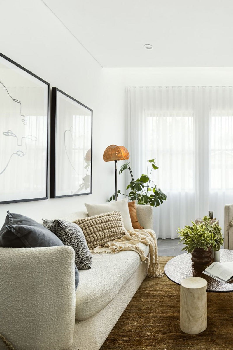 floor lamp next to a sofa in a living room