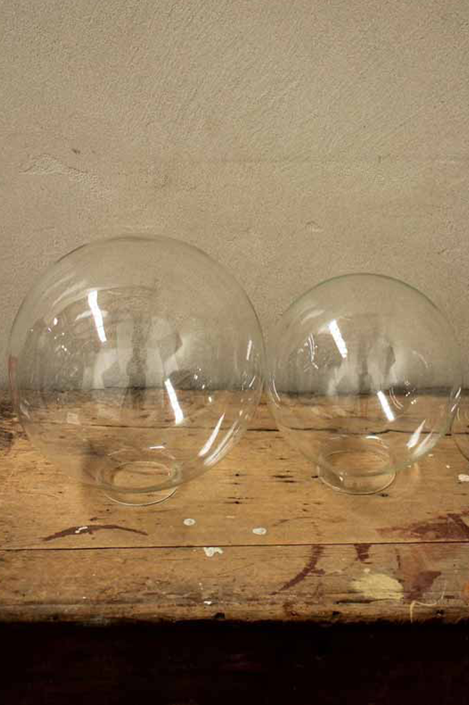 Medium and large clear glass ball shades.