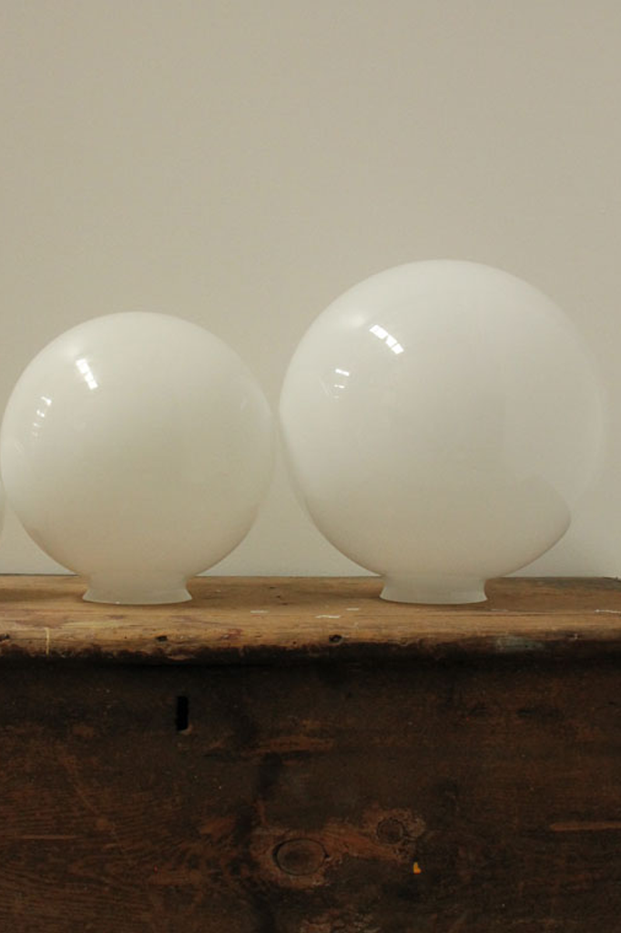 Medium and large opal glass ball shades.