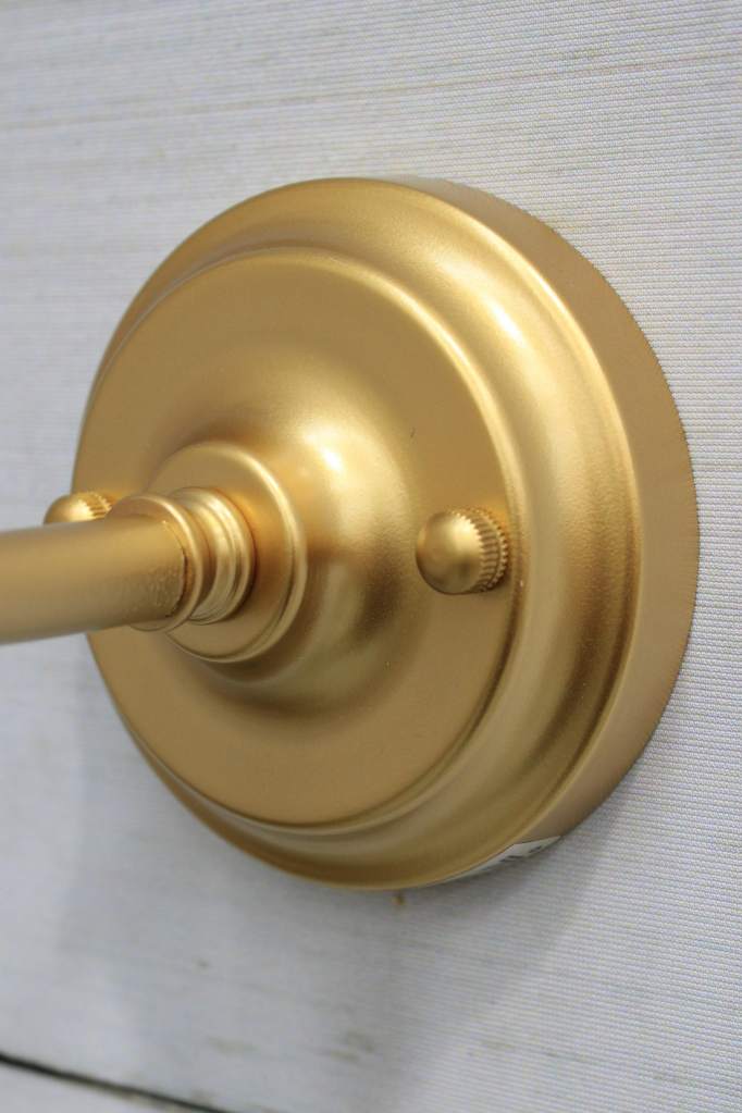 Gold/brass wall sconce.