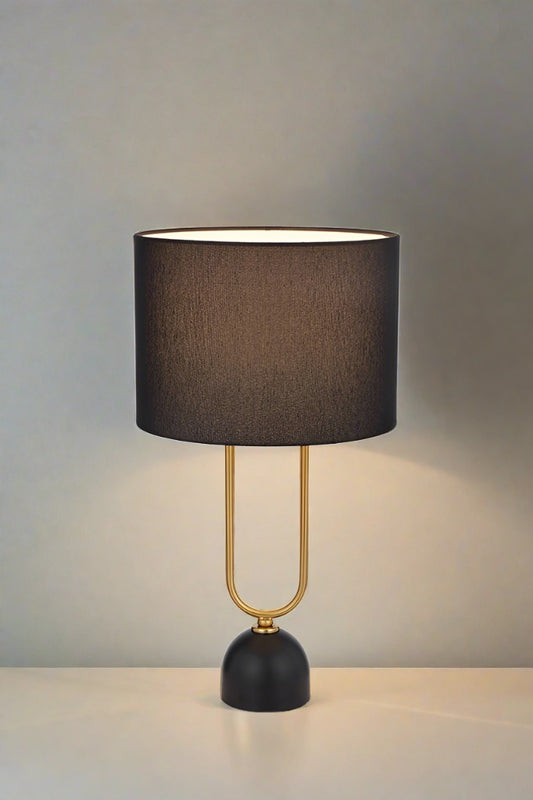 Table Lamp in black over a wooden table 