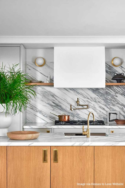 two wall lights in gold finish in the kitchen.