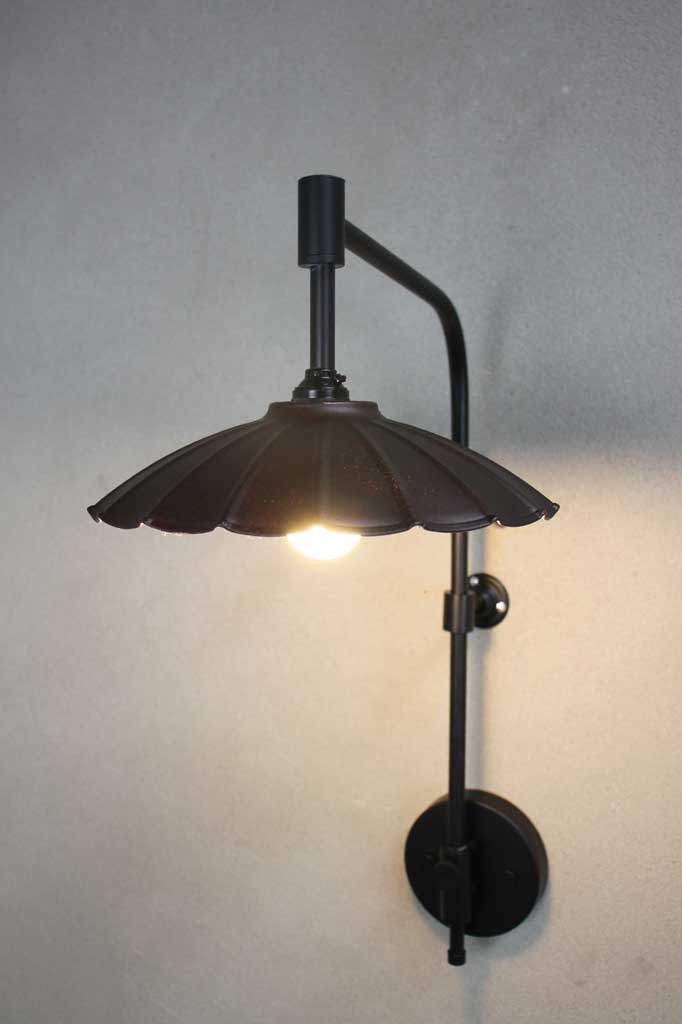 Black wing arm with a large black coloured umbrella shade