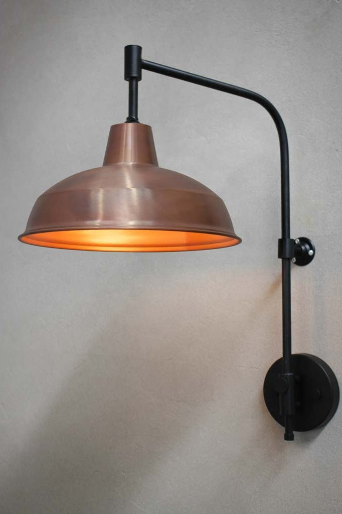 Warehouse Wing Arm Wall Lamp with black arm and copper shade.