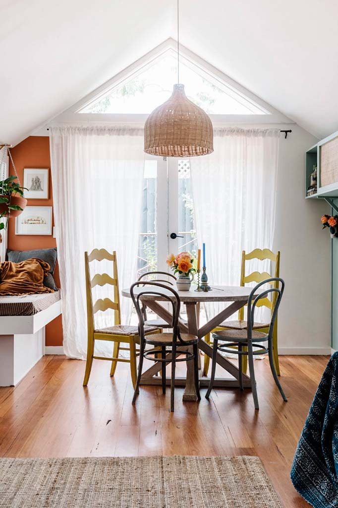 wicker pendant light over dining table