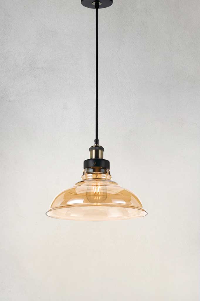 Glass pendant light with large amber shade