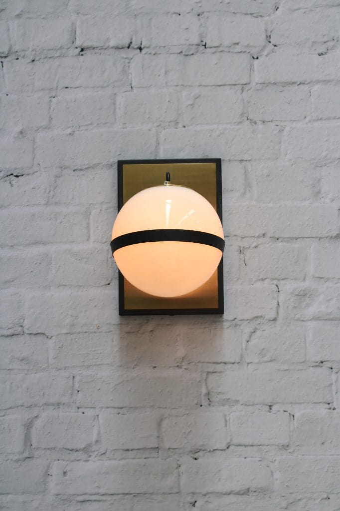 Glass ball wall light with brass mount