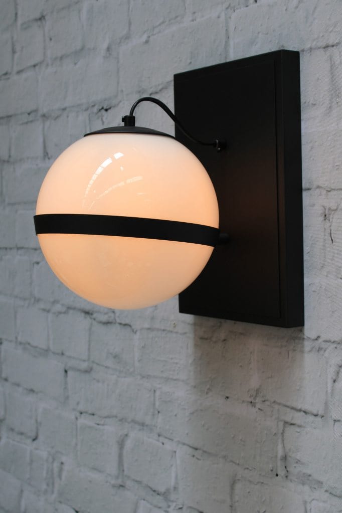 Glass ball wall light with steel mount in black finish