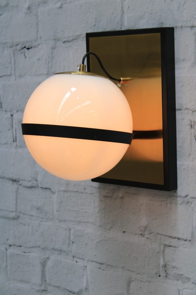 Glass ball wall light with brass mount