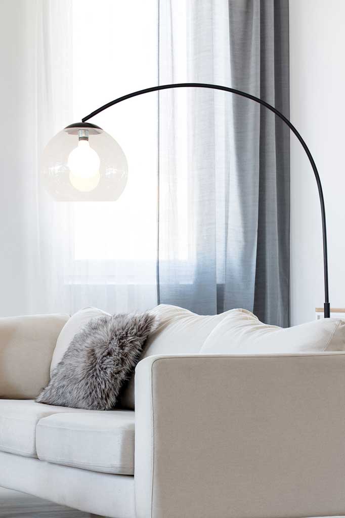 Black arc floor lamp for overhead lighting