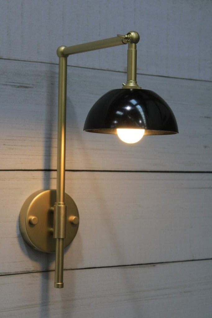 Gold/brass sconce with black shade