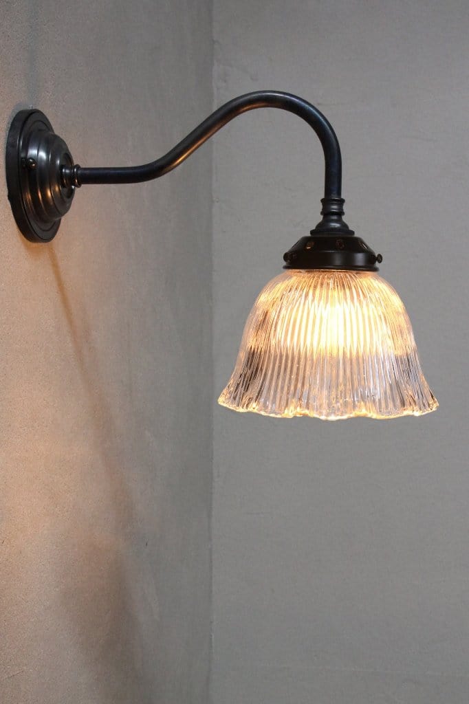 Antique bronze wall light with frill shade'