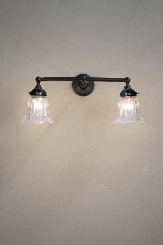 Black double arm wall light with clear glass shades