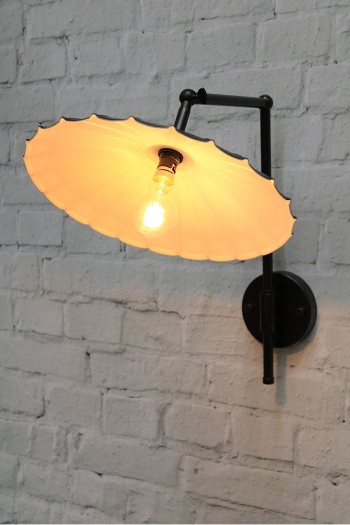 black wall light with large umbrella shade