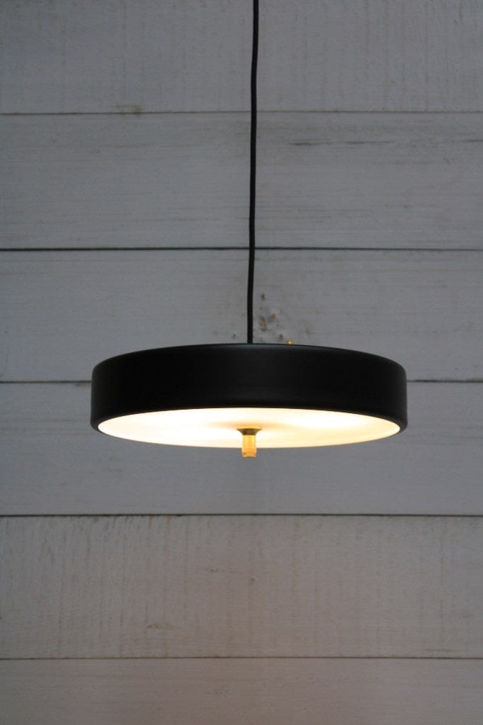 Pendant light with black finish and gold/brass metalware and frosted diffuser