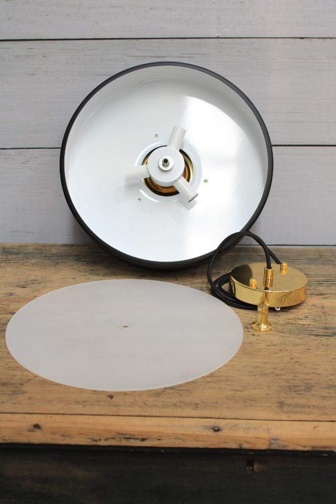 Pendant light disassembled to show three lampholders and white reflective inner finish