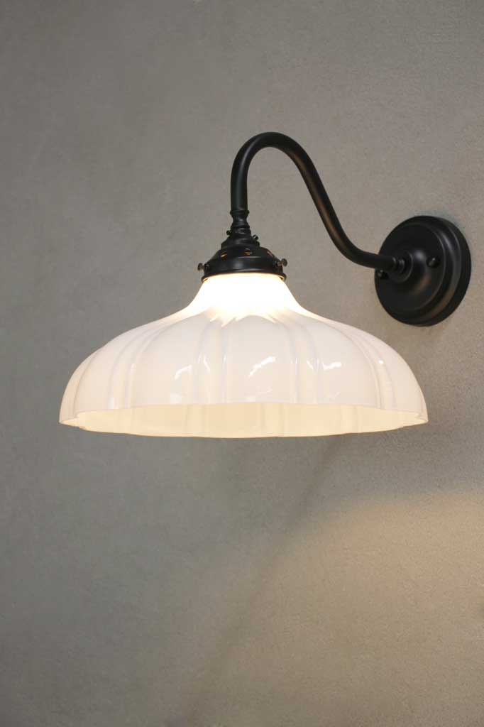 Black steel sconce with large opal glass shade