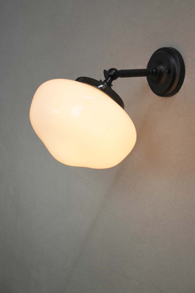 Black wall light with small opal plain shade