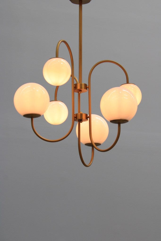 Six light chandelier in a gold finish