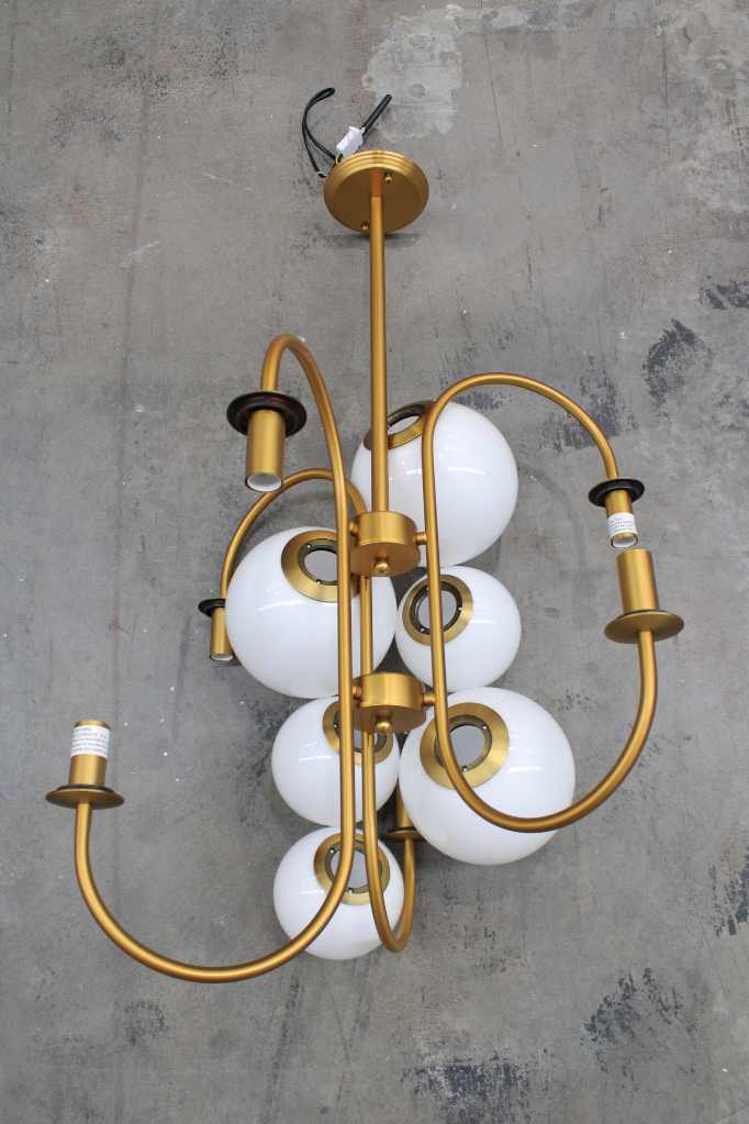 Disassembled chandelier in gold finish